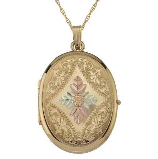 Four picture gold locket with pink gold flowers and green gold Black Hills Gold leaves and grape clusters. It's a beautiful thing. Available from The Men's Jewelry Store.