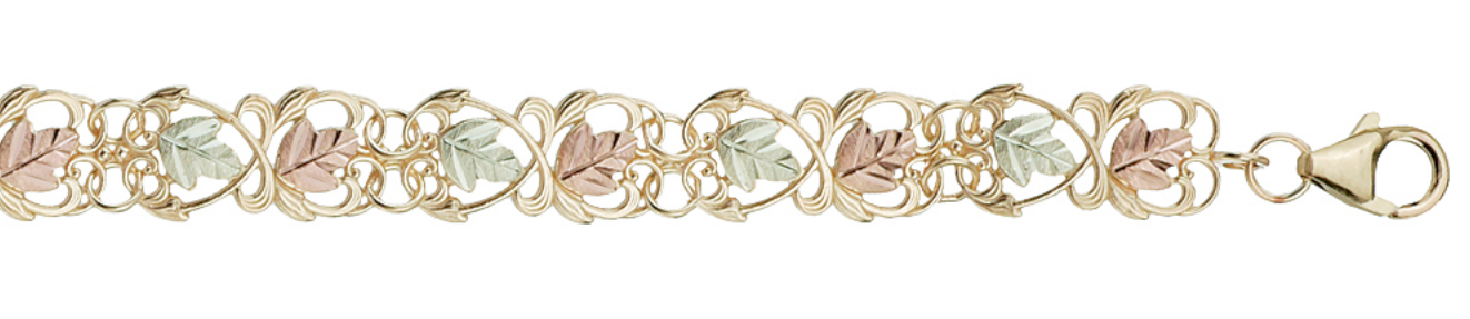 Elegant filigree grape vine bracelet in tricolor gold with the famous Black Hills Gold motif.