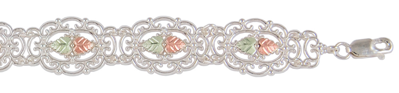 Victorian inspired sterling silver oval filigree bracelet with 12k green grape leaves and 12k pink gold grape leaves.