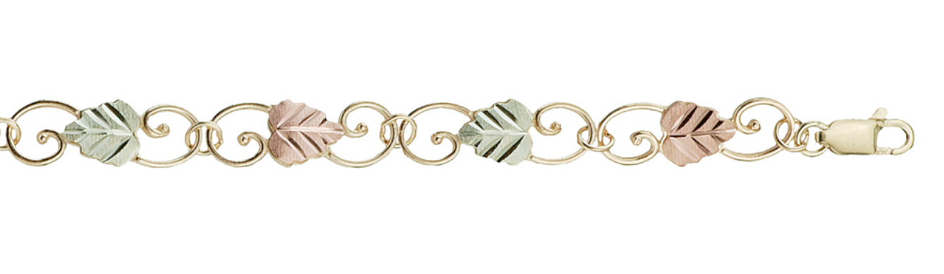 Delicate yellow gold scrollwork interlaced with green gold and pink gold hand-sculptured grape leaves make this bracelet absolutely exquisite and unique.