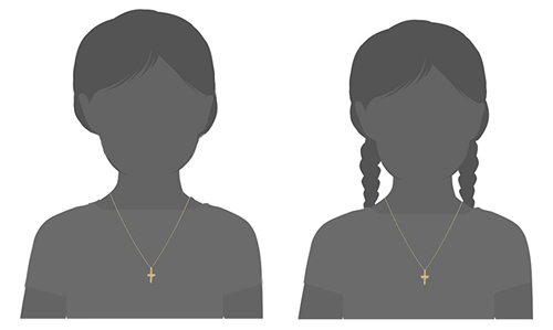 Little boy and girl models with a 14k yellow gold cross necklace with a raised heart on-center of the cross.