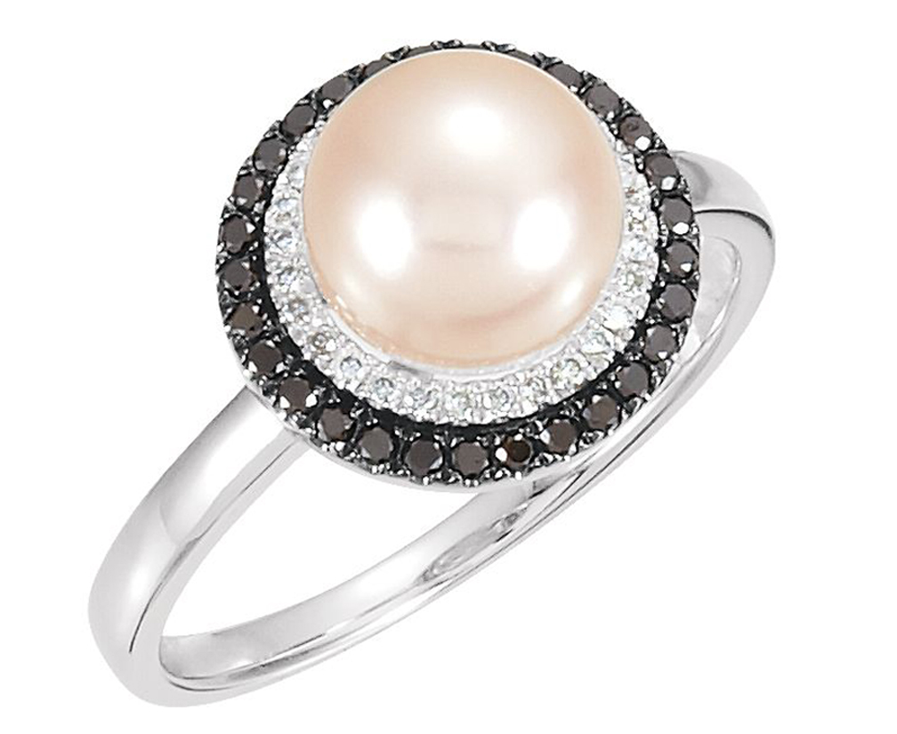 Gorgeous white, round, freshwater cultured pearl with a white diamond surround and a black diamond halo; statement ring is crafted in rhodium-plated 14k white gold.