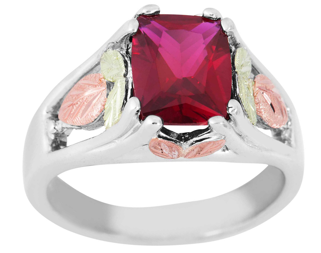 Created Garnet January birthstone ring crafted in rhodium plated sterling silver with 12k rose and green gold leaf embellishments.
